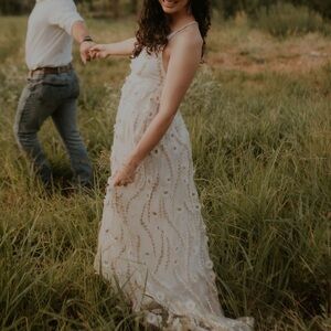 Altered state white gown with flowers down it